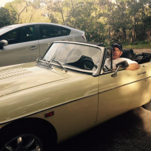 My husband, in one of his classic British cars.